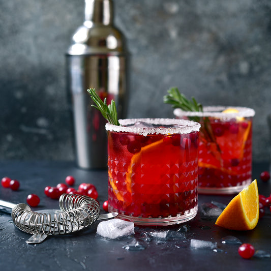 Holiday cranberry margarita recipe with mezcal and cranberry spice syrup