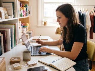 How to write product descriptions while a woman researches products and writes ecommerce copy on a laptop